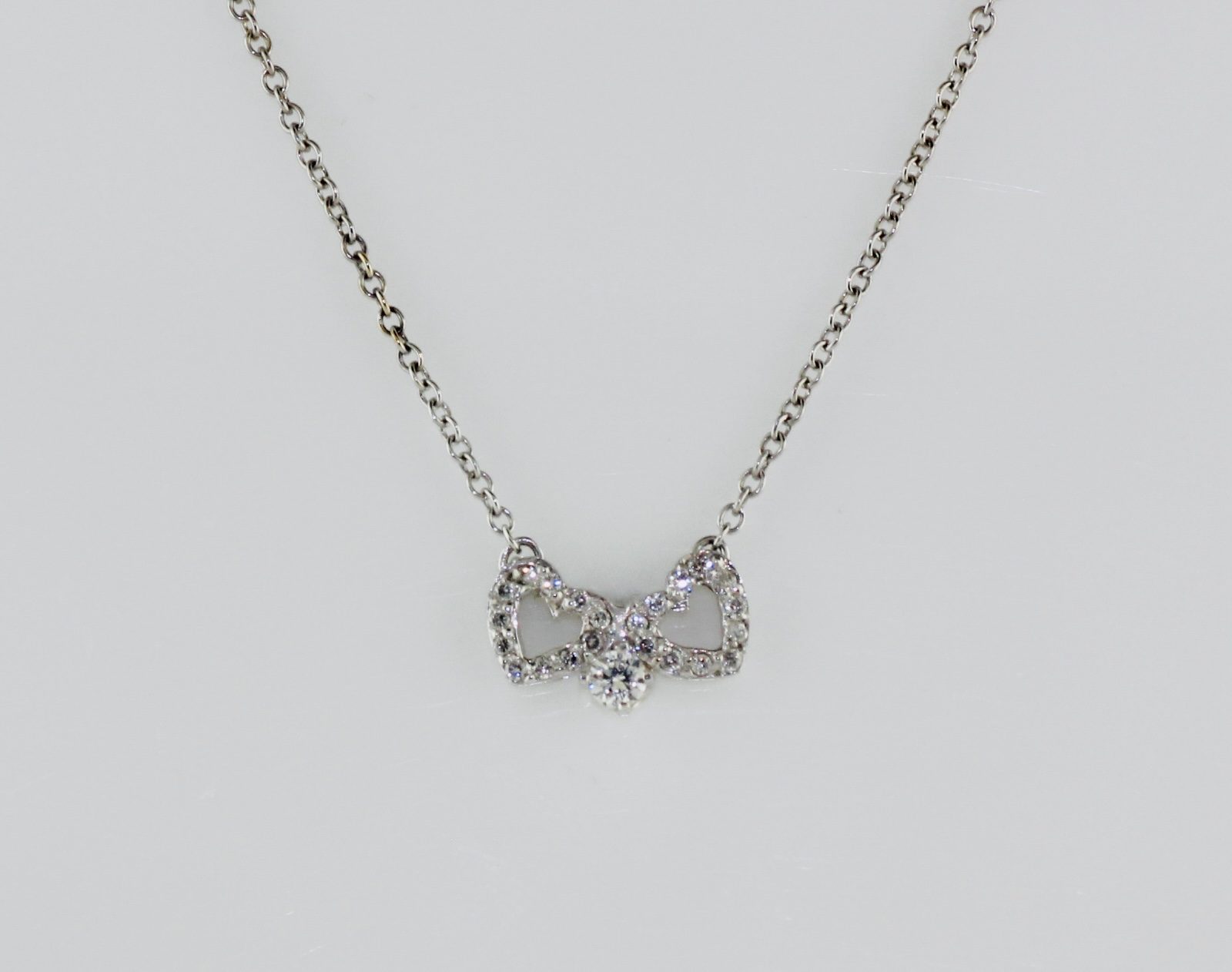 14K White Gold Diamond Bow and Heart Pendant