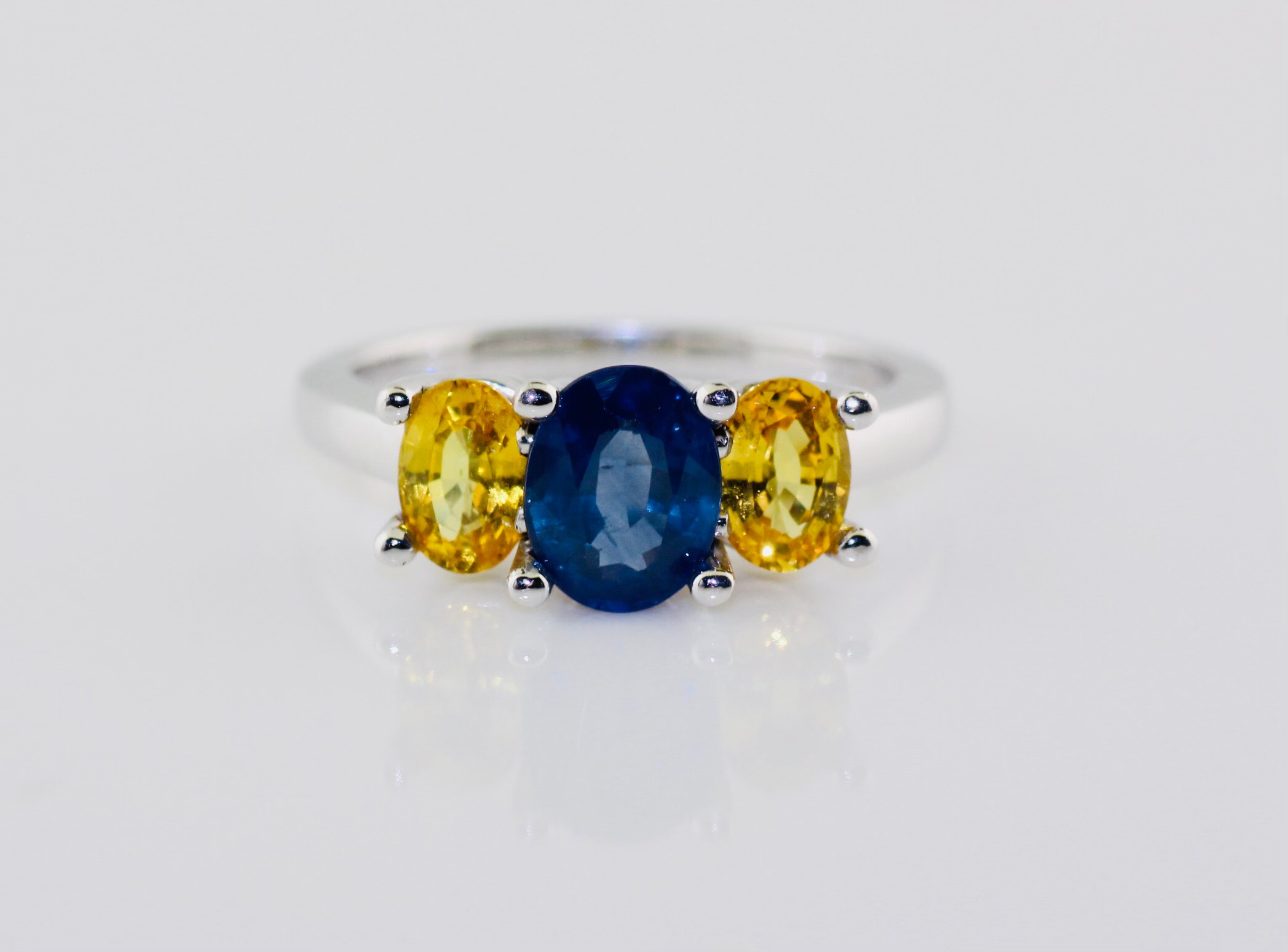 14K White Gold 3 Stone Oval Blue Sapphire (1.65cts) and Yellow Sapphire (1.27cts) Ring